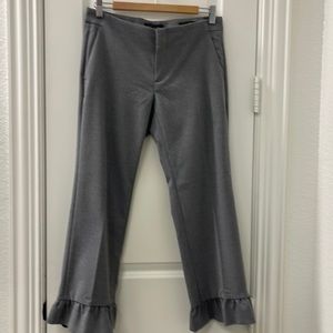 Grey trousers with ruffle hem
